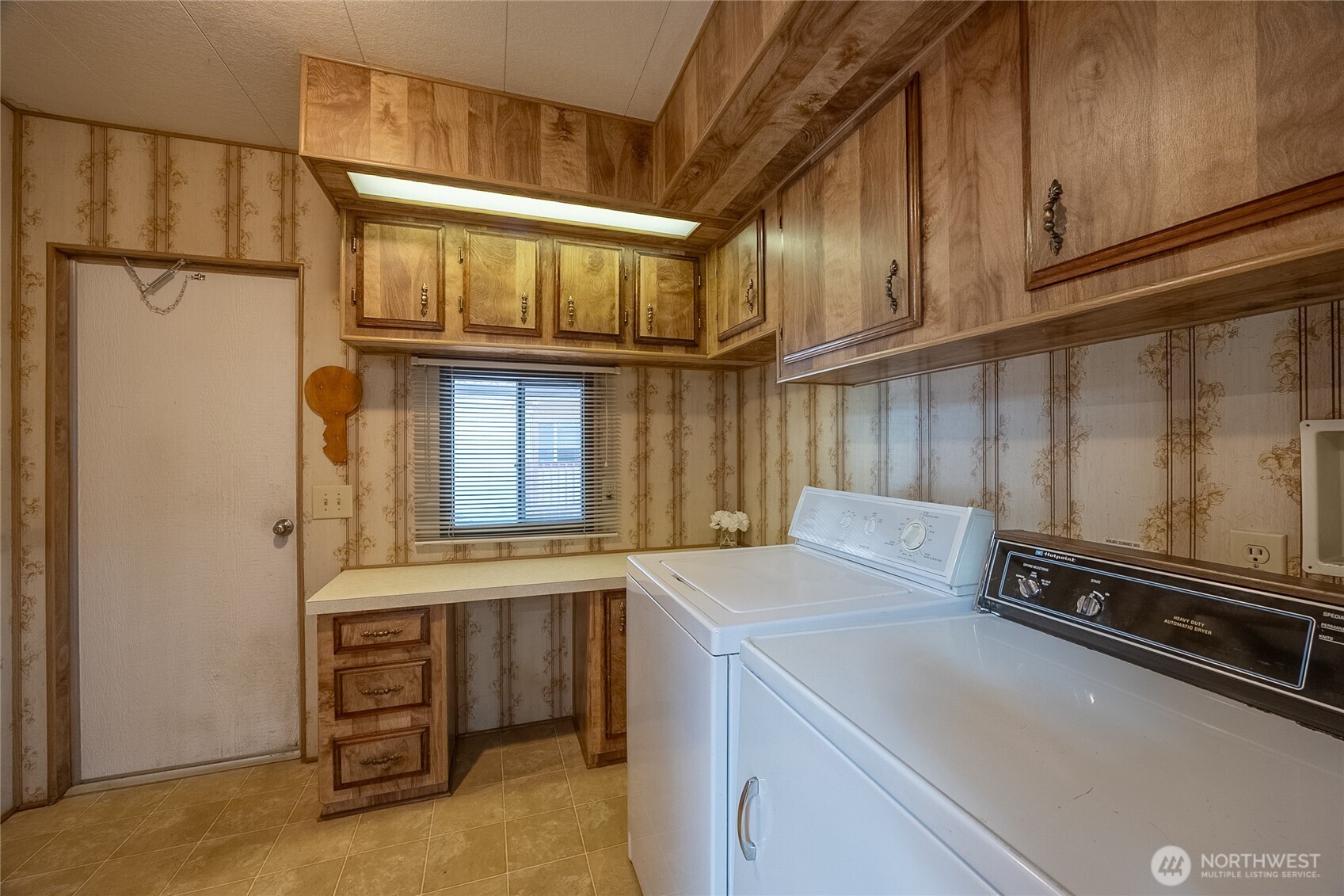 Laundry room with lots of cupboards and a large pantry not in photo. Washer/Dryer included.