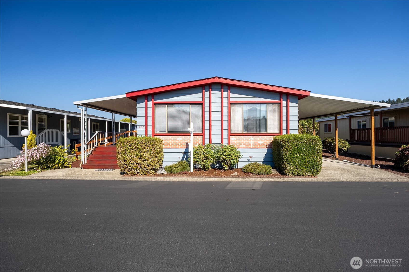 237 offers stairs and a ramp to front door! Double stairs off back porch.