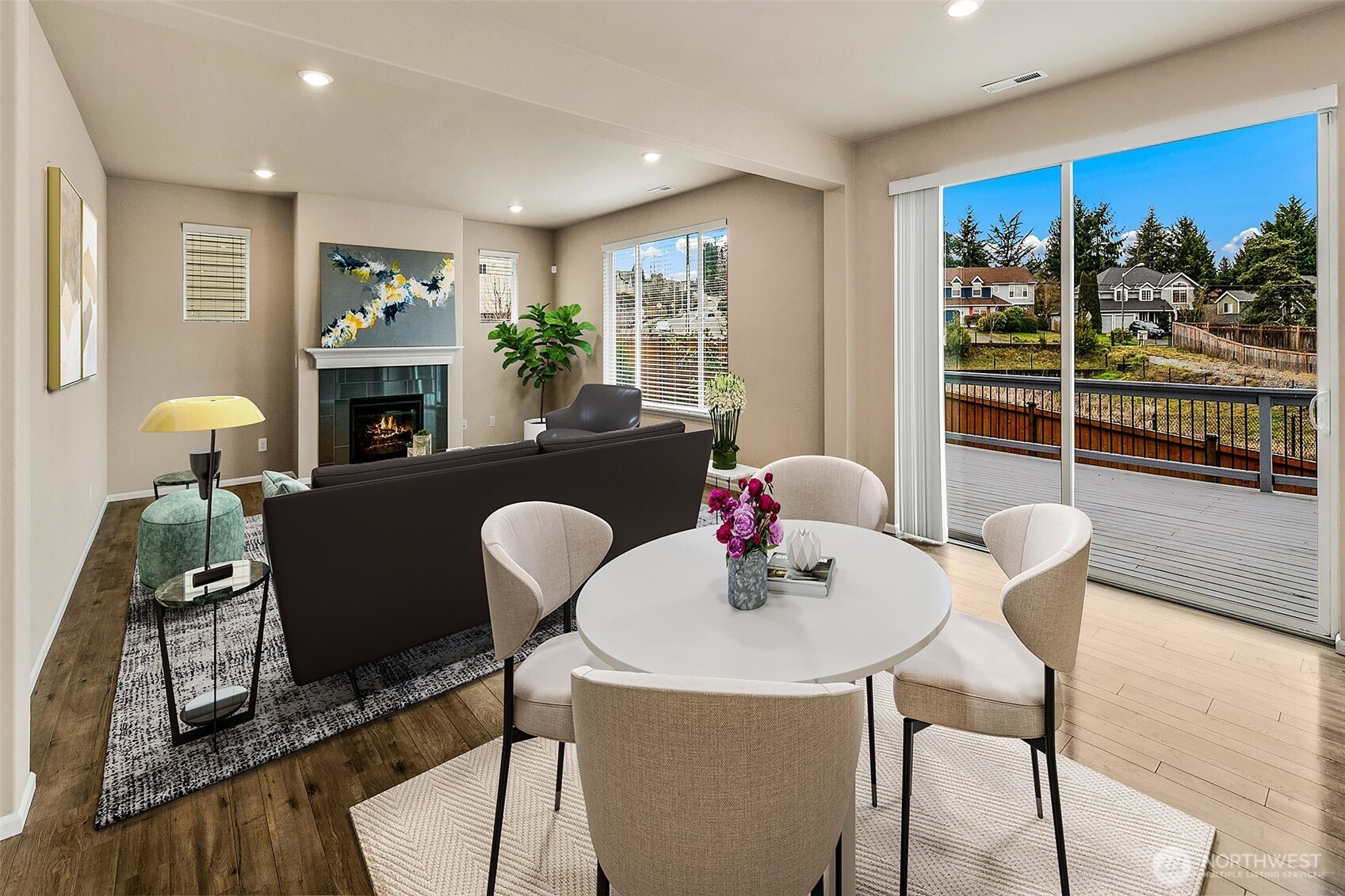 Living room with slider to back yard and large deck. This photo has been virtually staged.