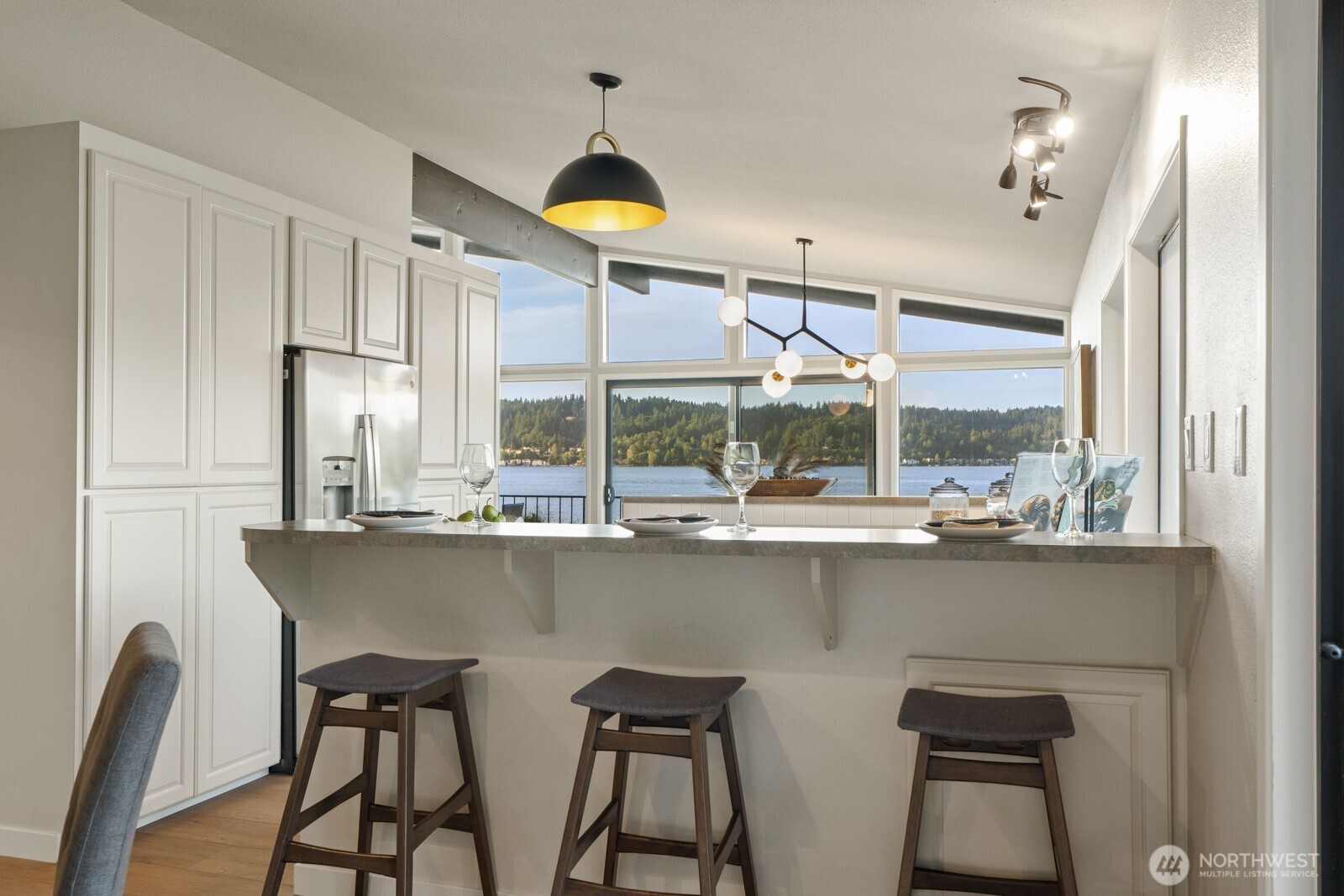 barstools facing the lake