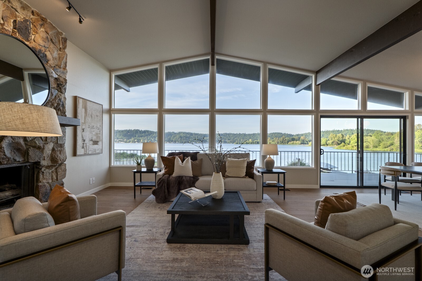 Living room with wall of windows facing the lake