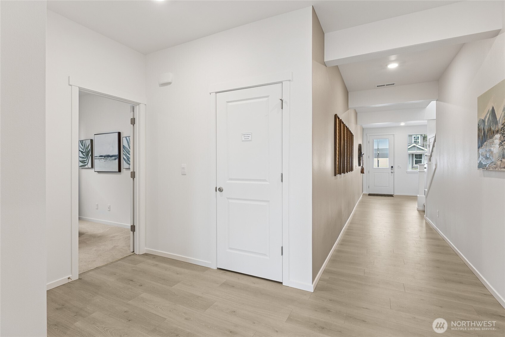 Downstairs bedroom/office shown with a full sized bed and large walk in closet.  Pictures are for representational purposes only, colors and features may vary.