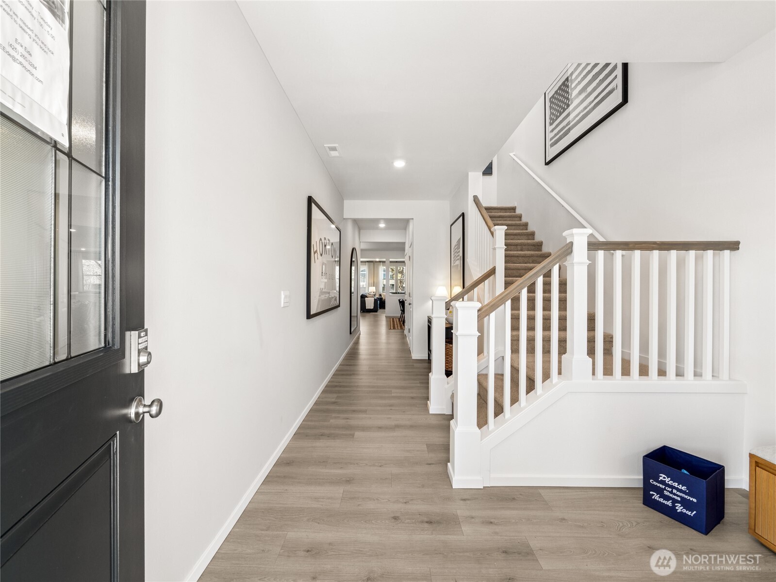 The tall ceiling and wide hallway welcome you inside.  Picture for representational purposes only, colors and features may vary.