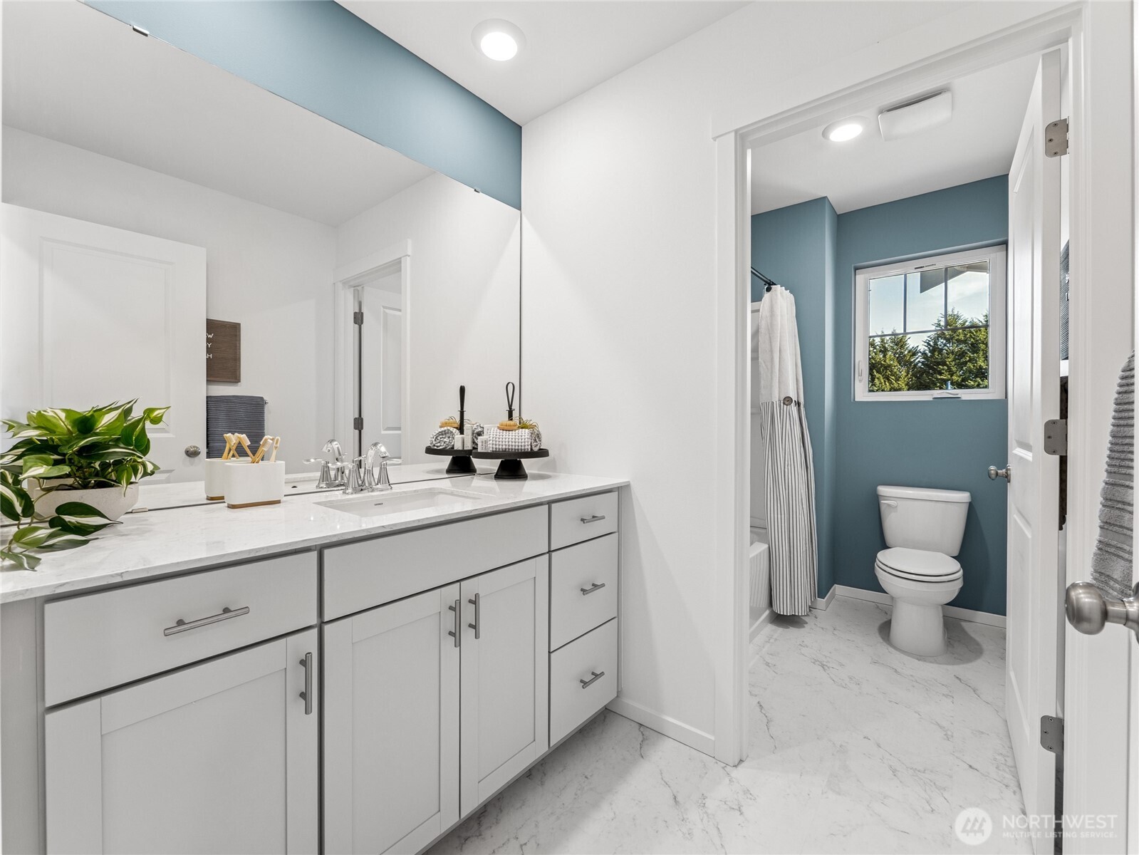 Upstairs hall bathroom with separate shower and toilet room.  Picture for representational purposes only, colors and features may vary.