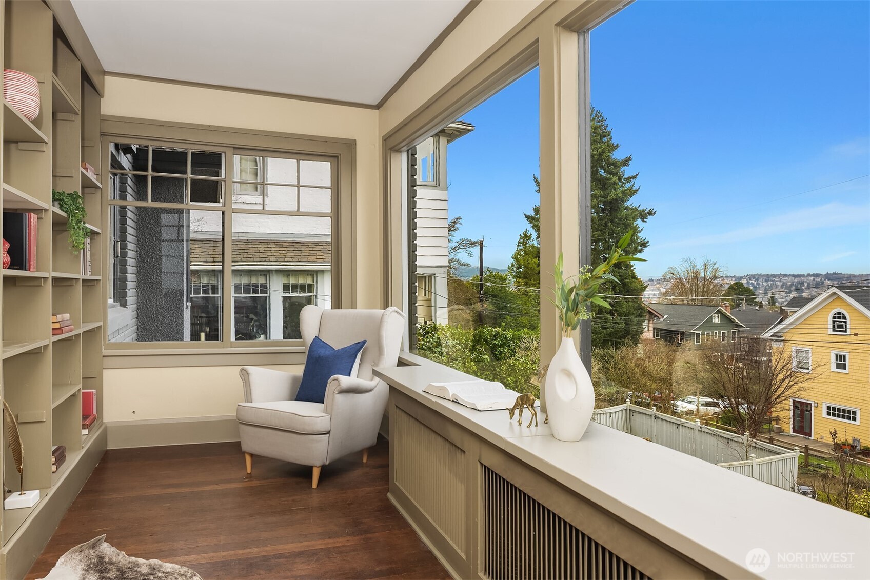 Library and sitting room on main floor with oversized windows and plenty of light.
