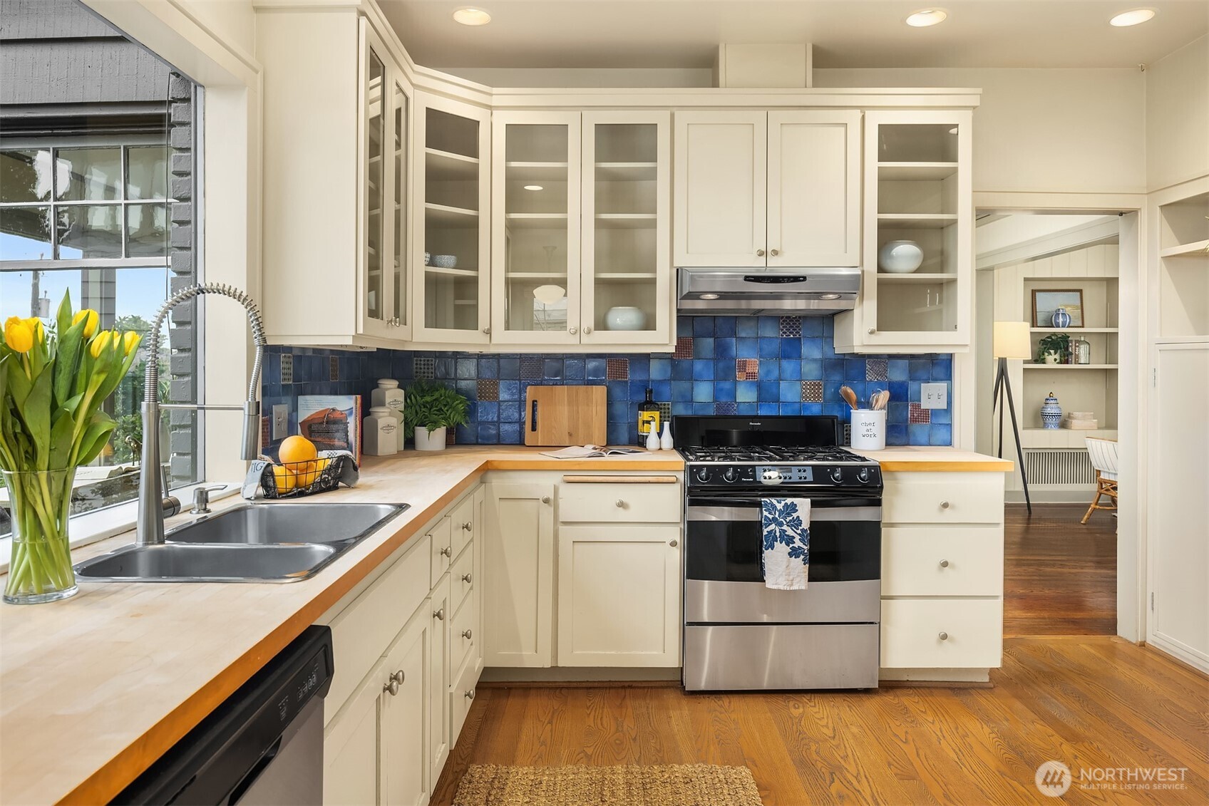 built in cabinets throughout kitchen and gas range.