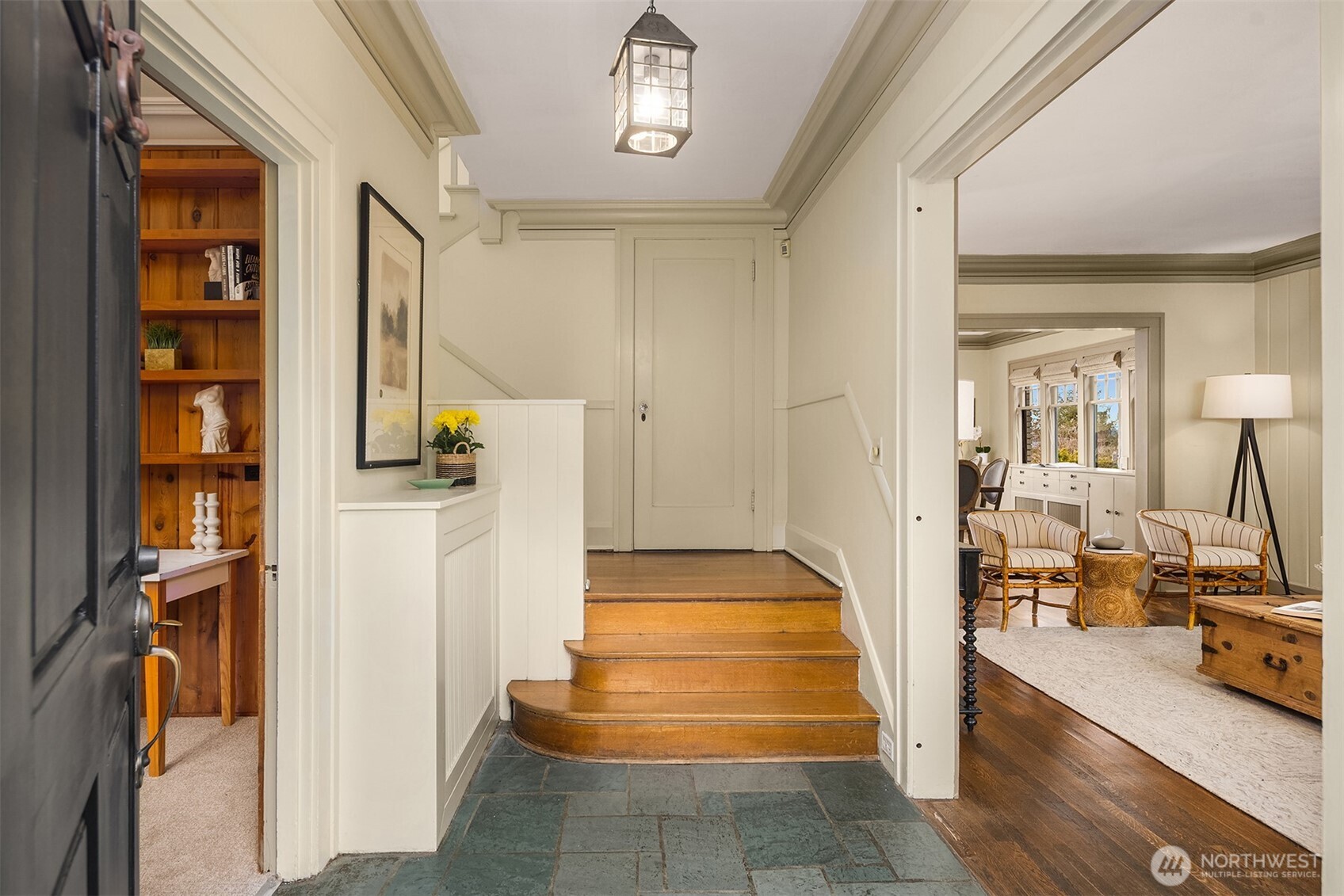 Slate entry with oak hardwood stairs lead gracefully up to the four bedrooms.
