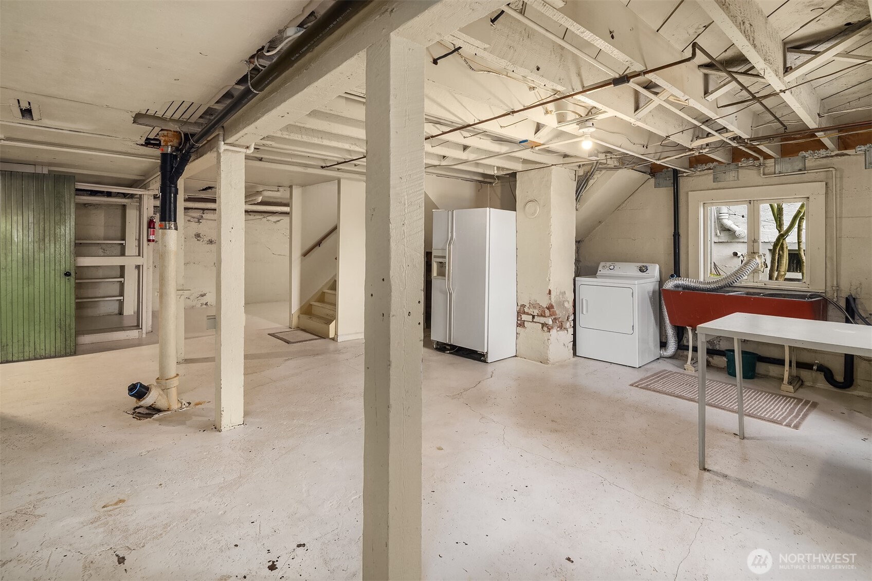 Laundry and extra refrigerator.