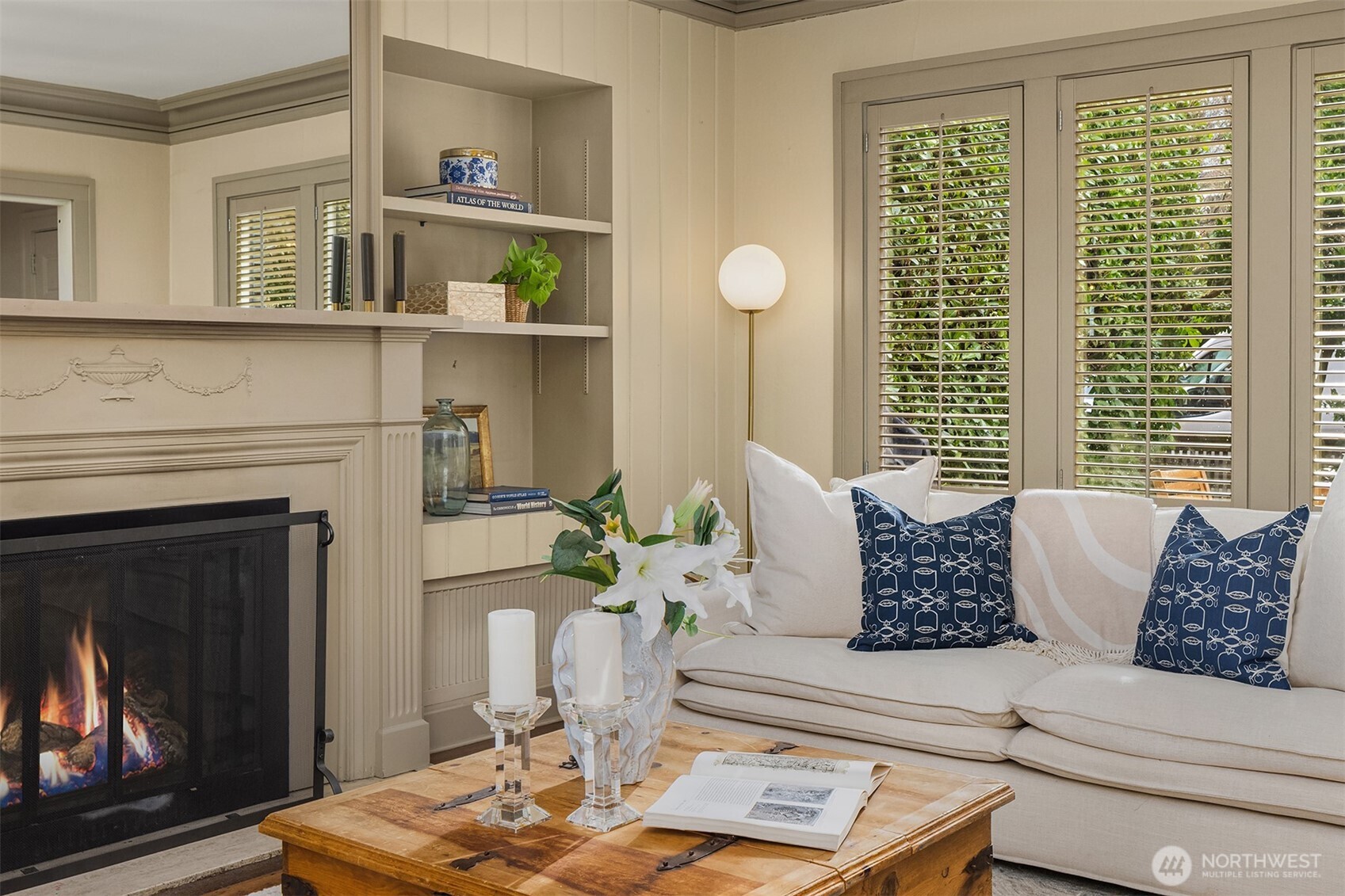 Large-scale living room with hardwood floors.