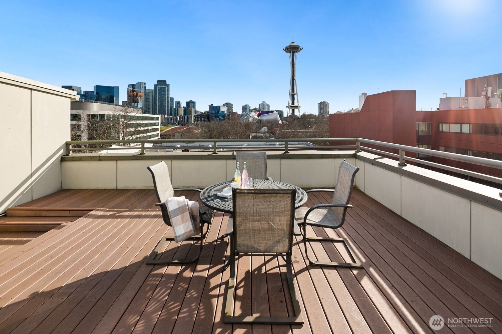 Rooftop deck with Space Needle and Seattle
