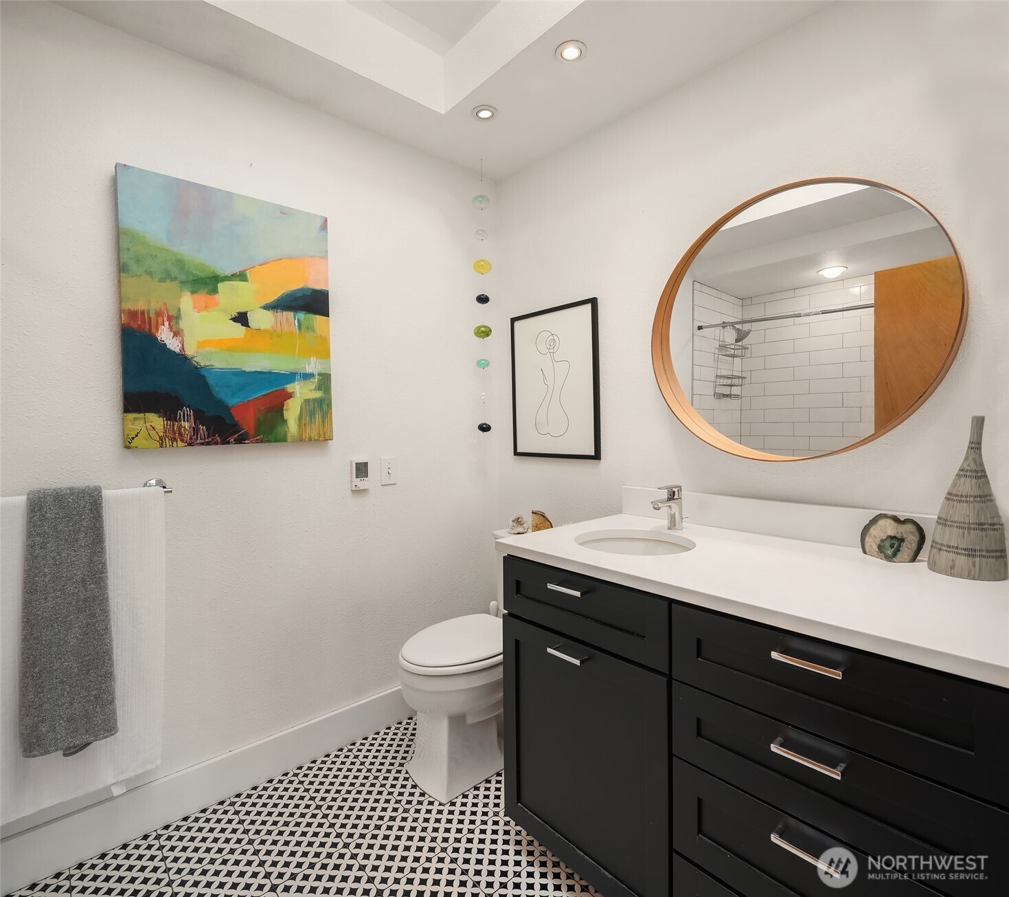 Primary has large closet, spacious bath & access to deck & patio.