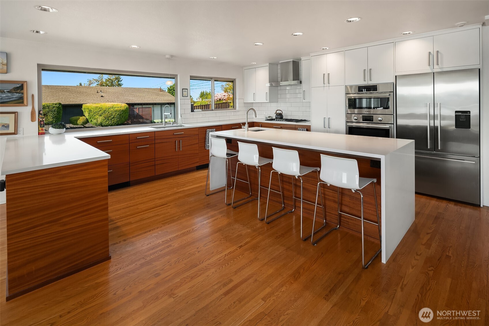 Clean classic lines & new wood cabinets with quartz counters are enhanced by natural light