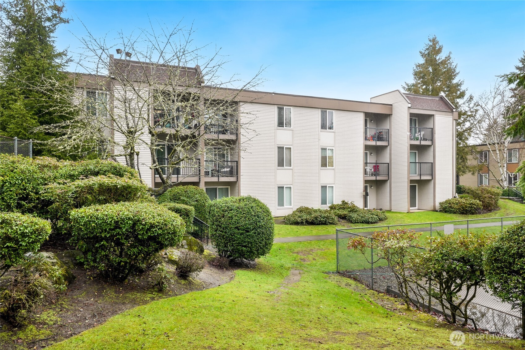 Lovely grounds looking back toward the mid level, corner unit