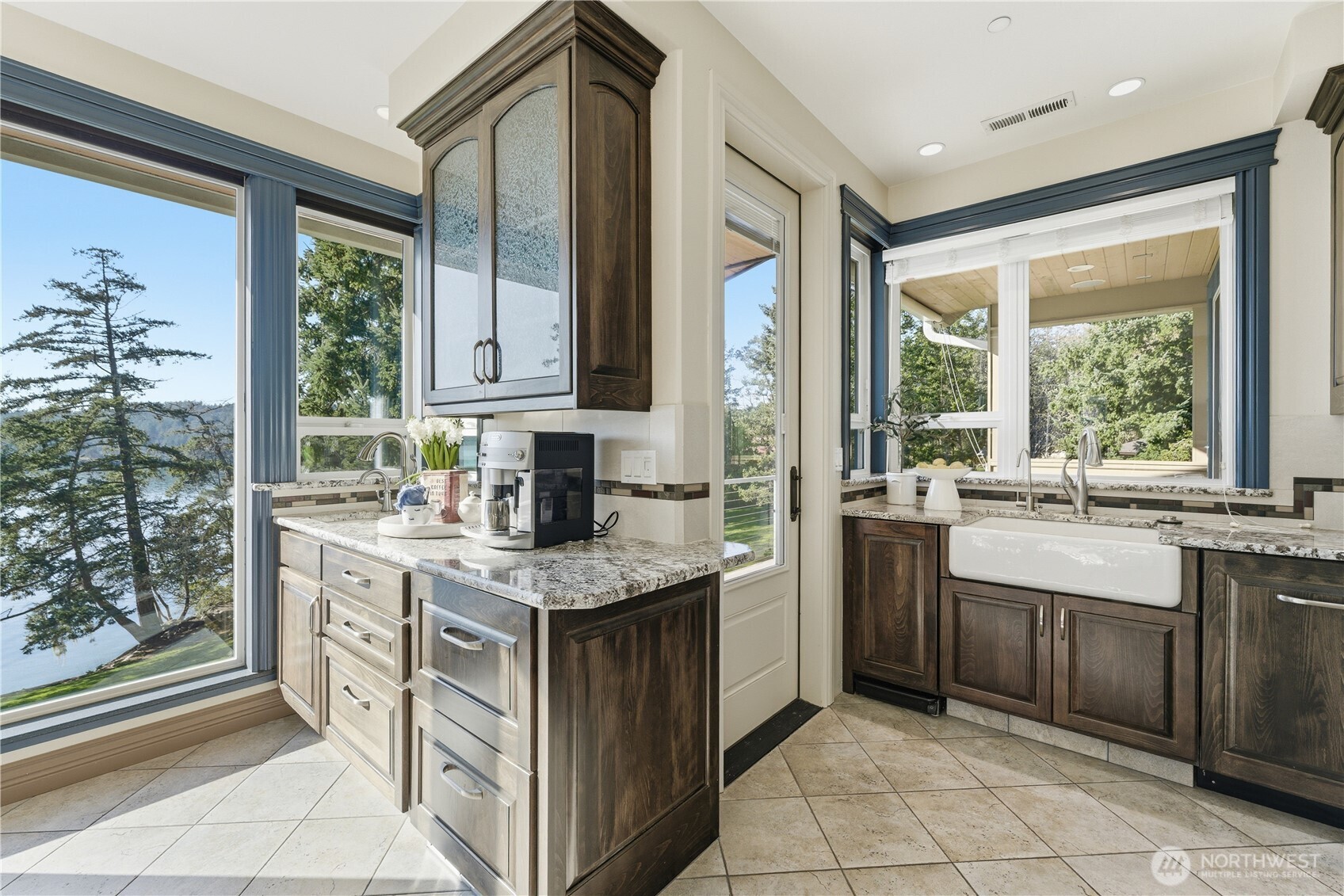 Kitchen view featuring the beverage bar with dual drawer fridges and instant hot water, plus the scullery to the right with a second dishwasher, more drawer refrigeration, and RO water
