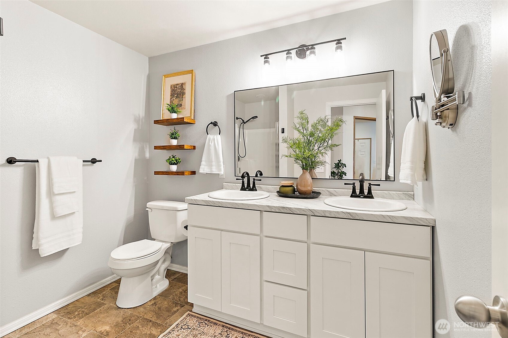 Primary en-suite with updated modern fixtures and double sinks