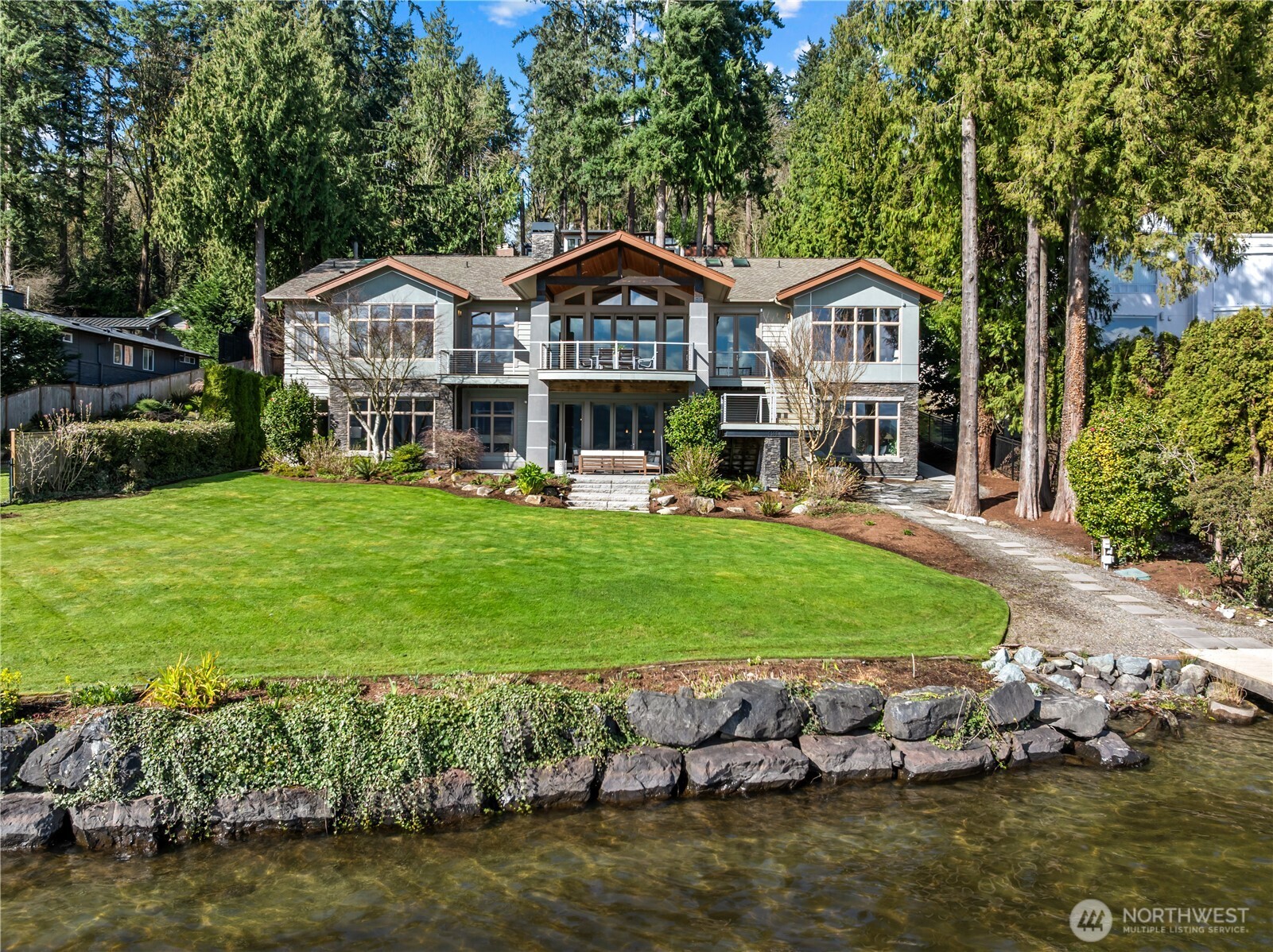 Set along one of Mercer Island’s most treasured stretches of East Mercer Way, this remarkable waterfront estate captures the essence of Pacific Northwest lakefront living.
