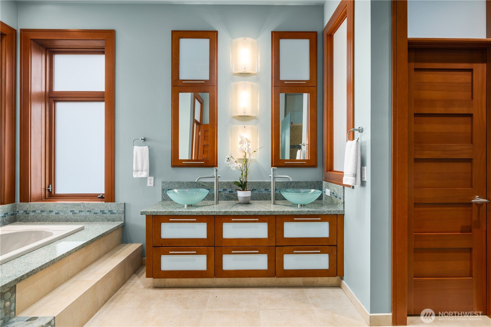 A true retreat—wake to lake views, unwind by the fire, and enjoy a private sitting area designed for relaxation.