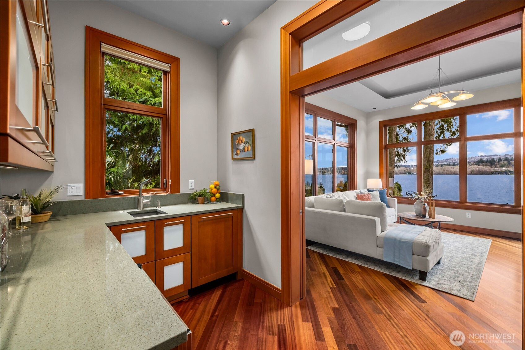 A jewel-box powder room—textured tile, stone surfaces, and statement lighting create a striking impression.
