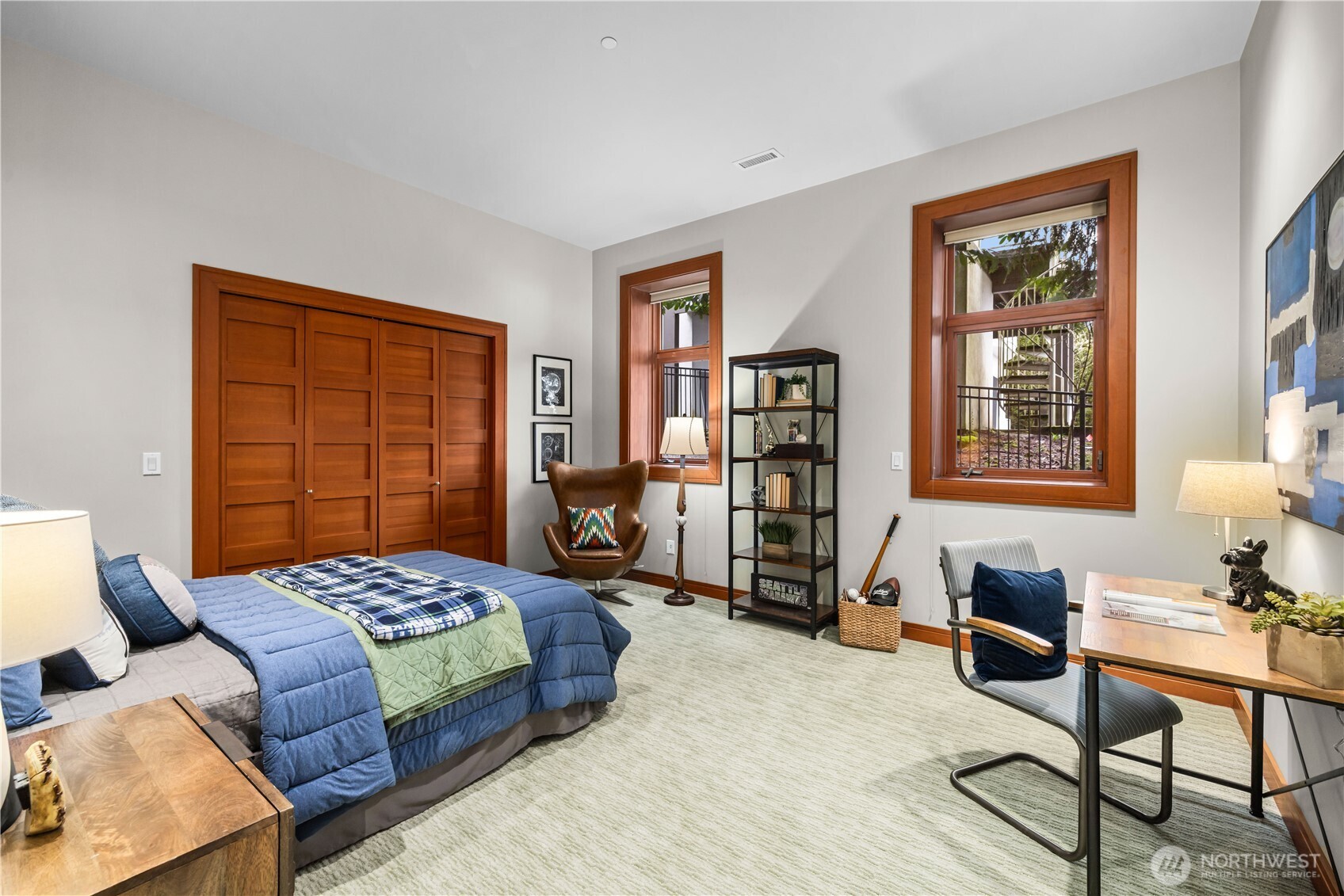 A bright and beautifully appointed shared bath with double vanities—perfect for busy mornings and easy everyday living.