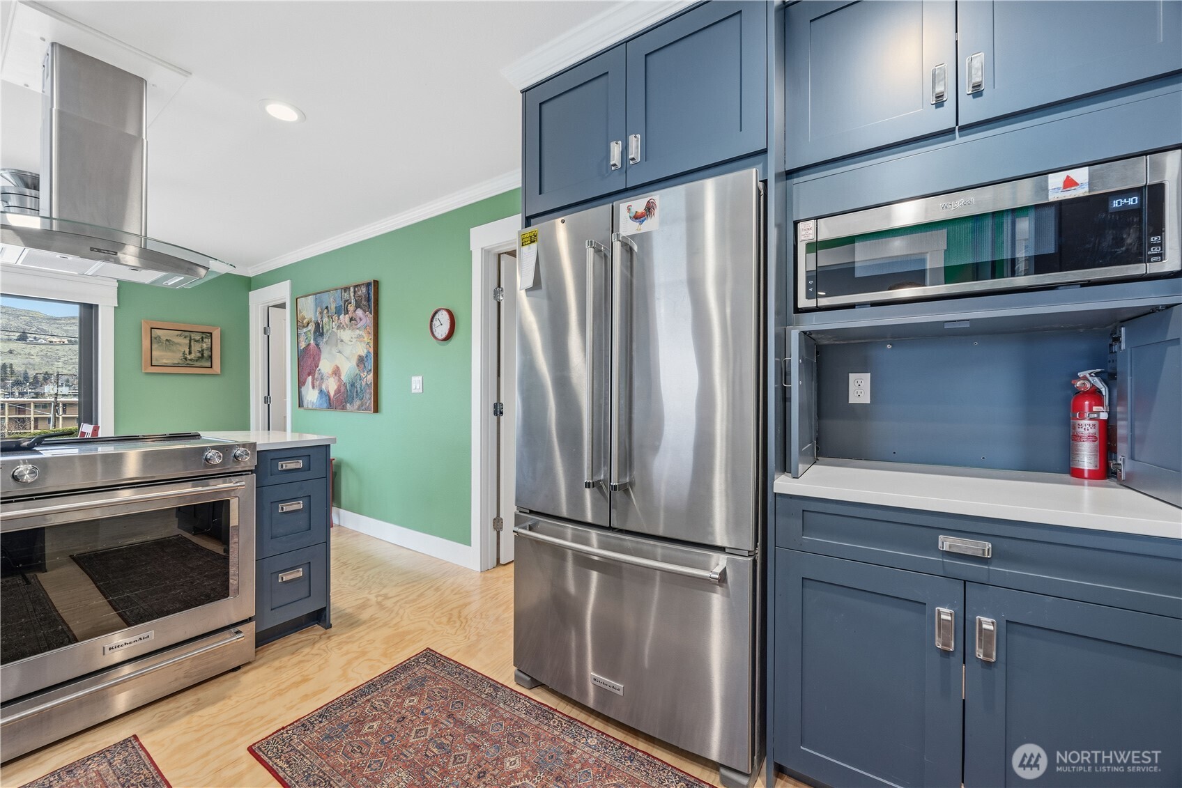 This newly remodeled condo features all stainless steel Kitchen Aide appliances and custom soft close cabinets.