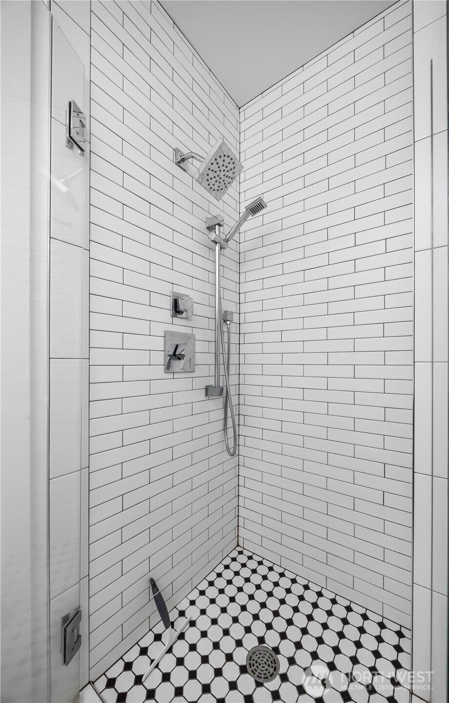 Right down the hallway is the guest restroom with large walk in shower.