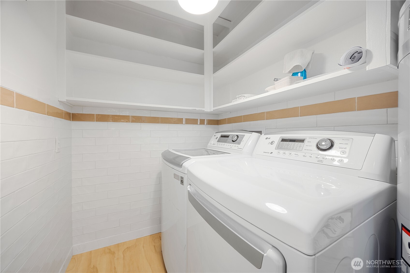 Laundry is conveniently located opposite the kitchen, for those gifted with multitasking.
