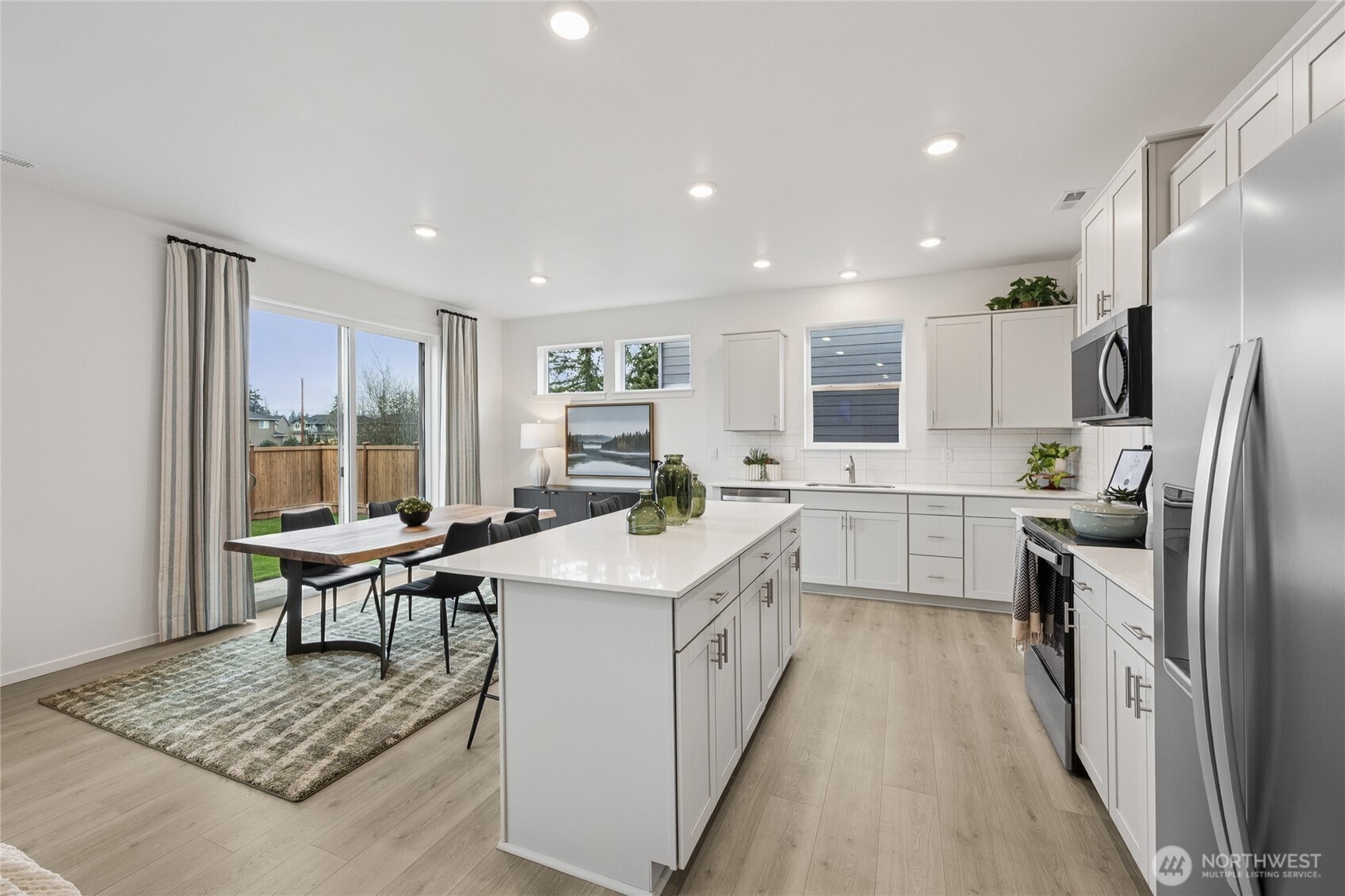 Large slider and side windows provide plenty of natural light.  Pictures are for representational purposes only, colors and features may vary.