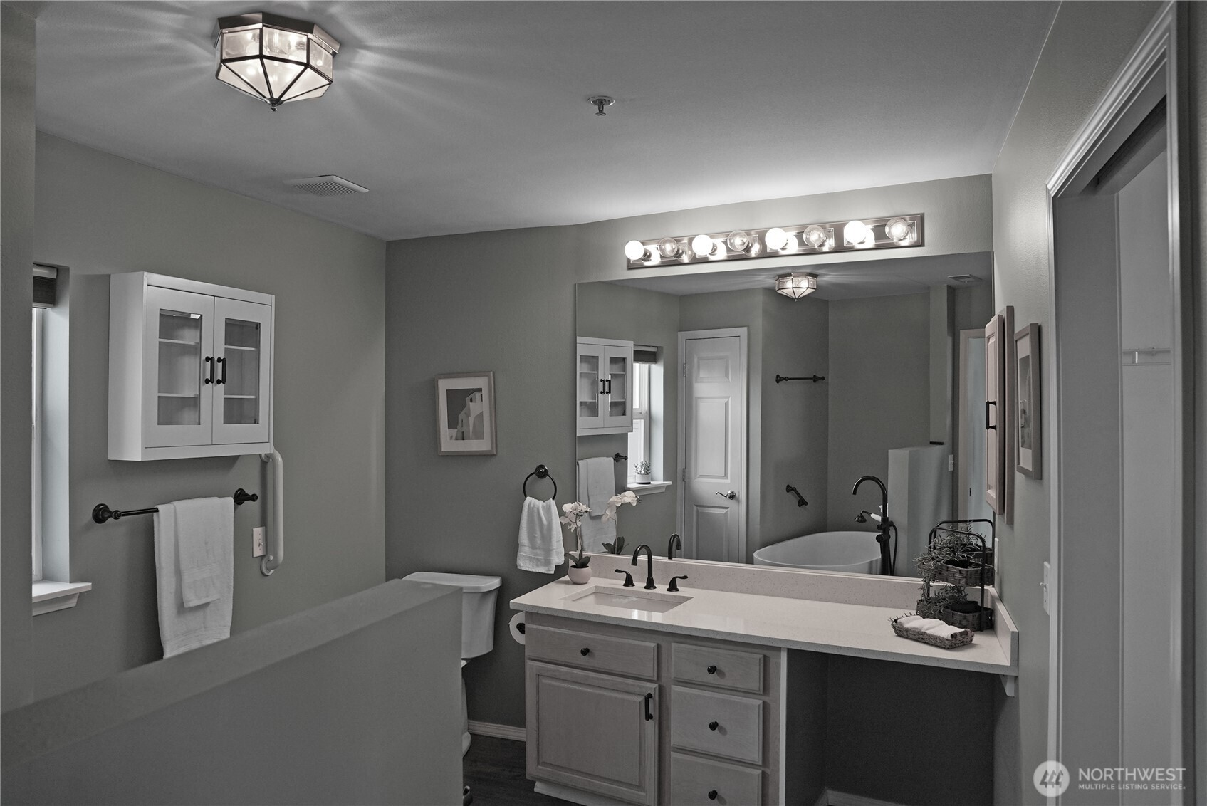 Renovated Primary Bathroom with quartz countertops and stand alone tub!