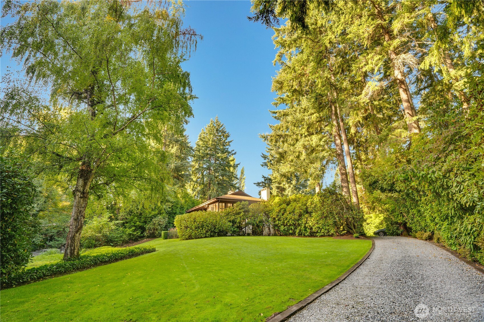 Amazing architecture on 12 secluded acres in the Heart of Lakewood with Chambers Creek running thru the property.