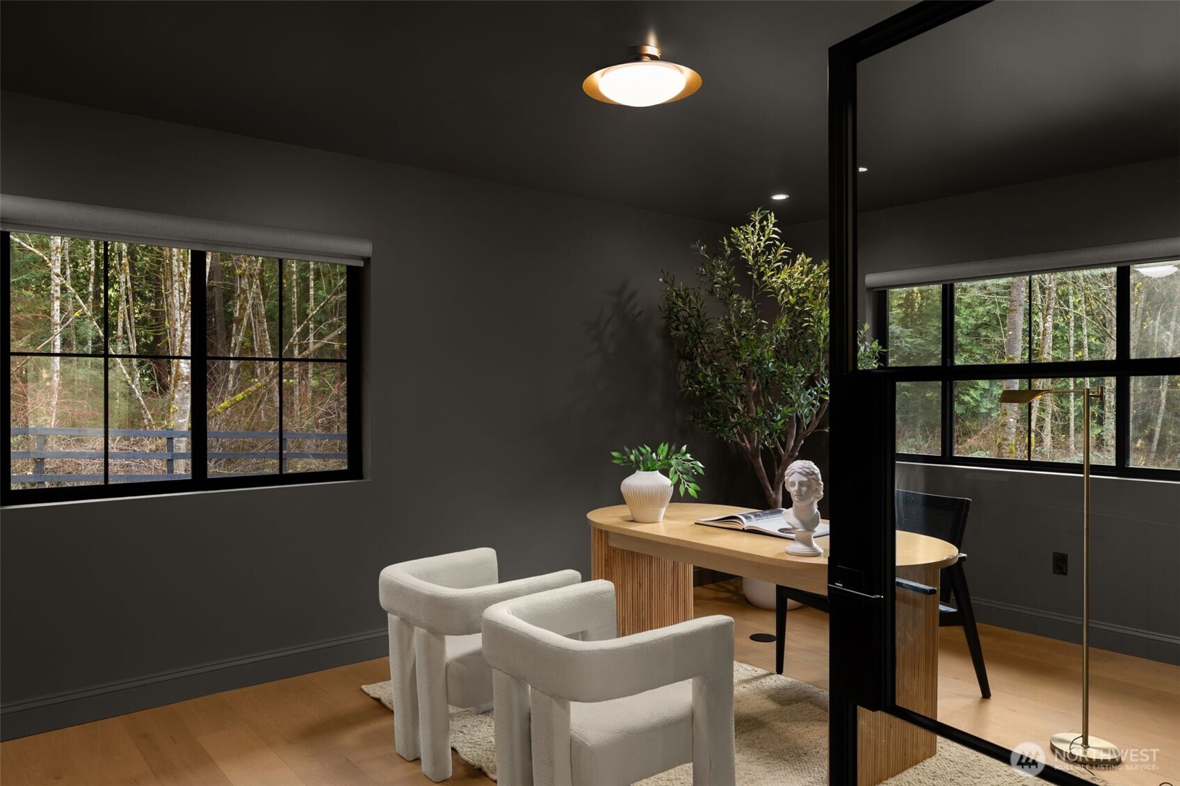 A dramatic color-drenched main floor office creates a rich feel