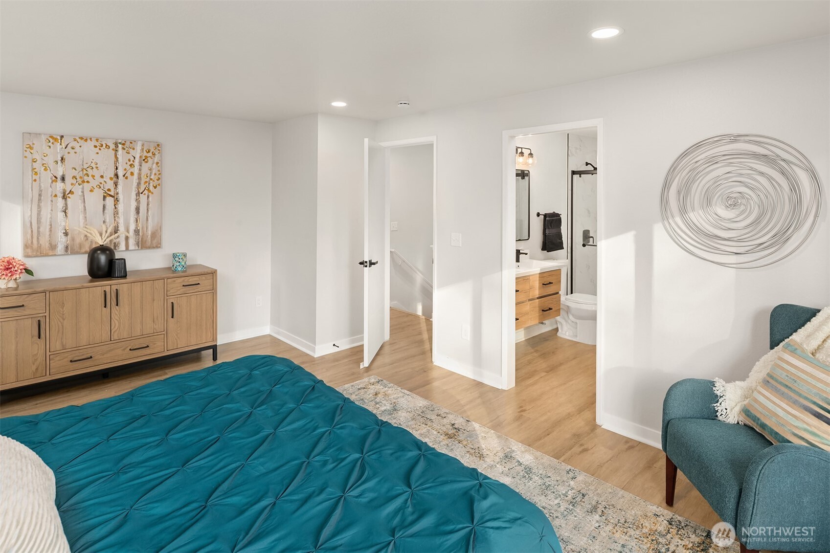 Fully remodeled primary bath with double sinks and walk-in shower.