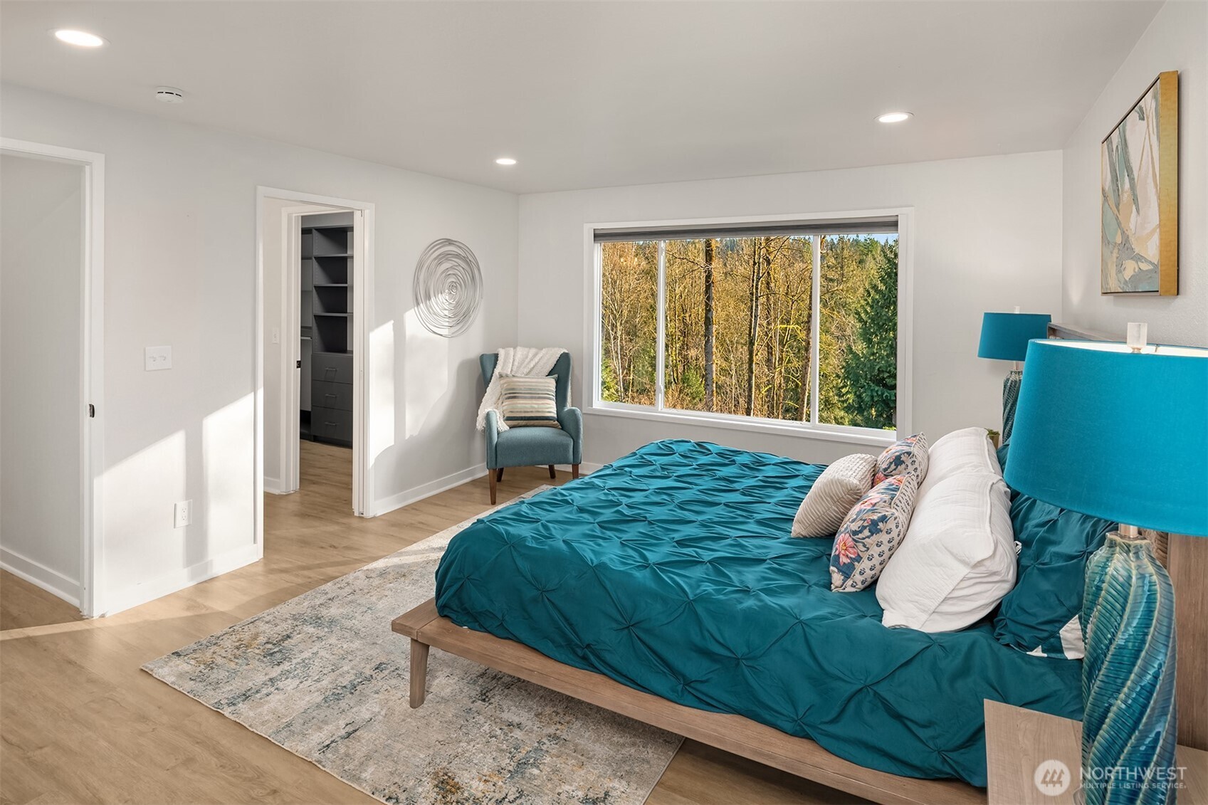 Primary BR walk-in closet with custom built-ins.