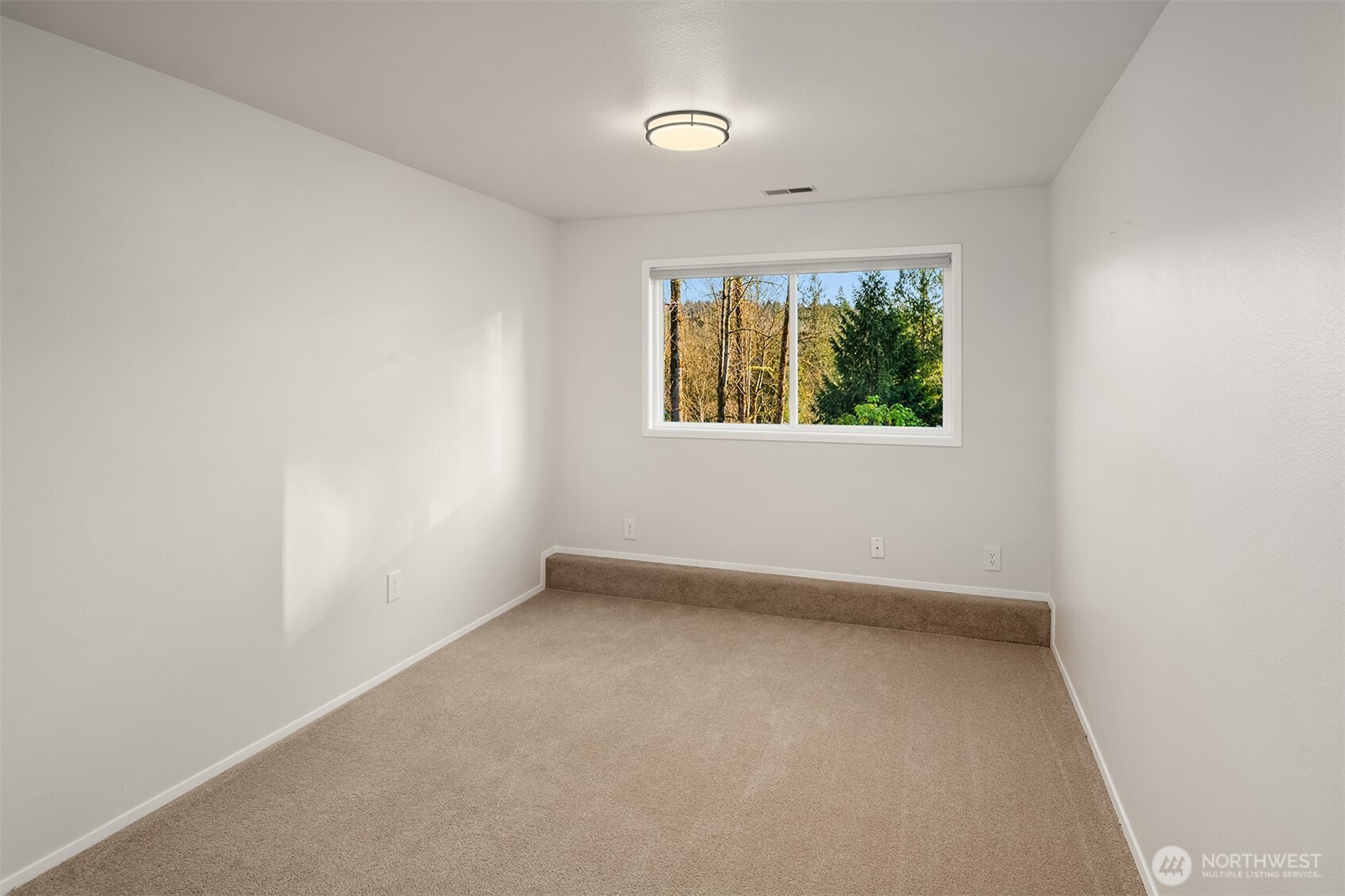 Large, dedicated laundry room with handy utility sink and extra storage.