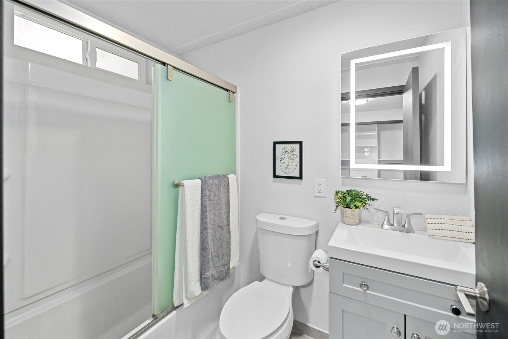 Second bedroom with backyard views.