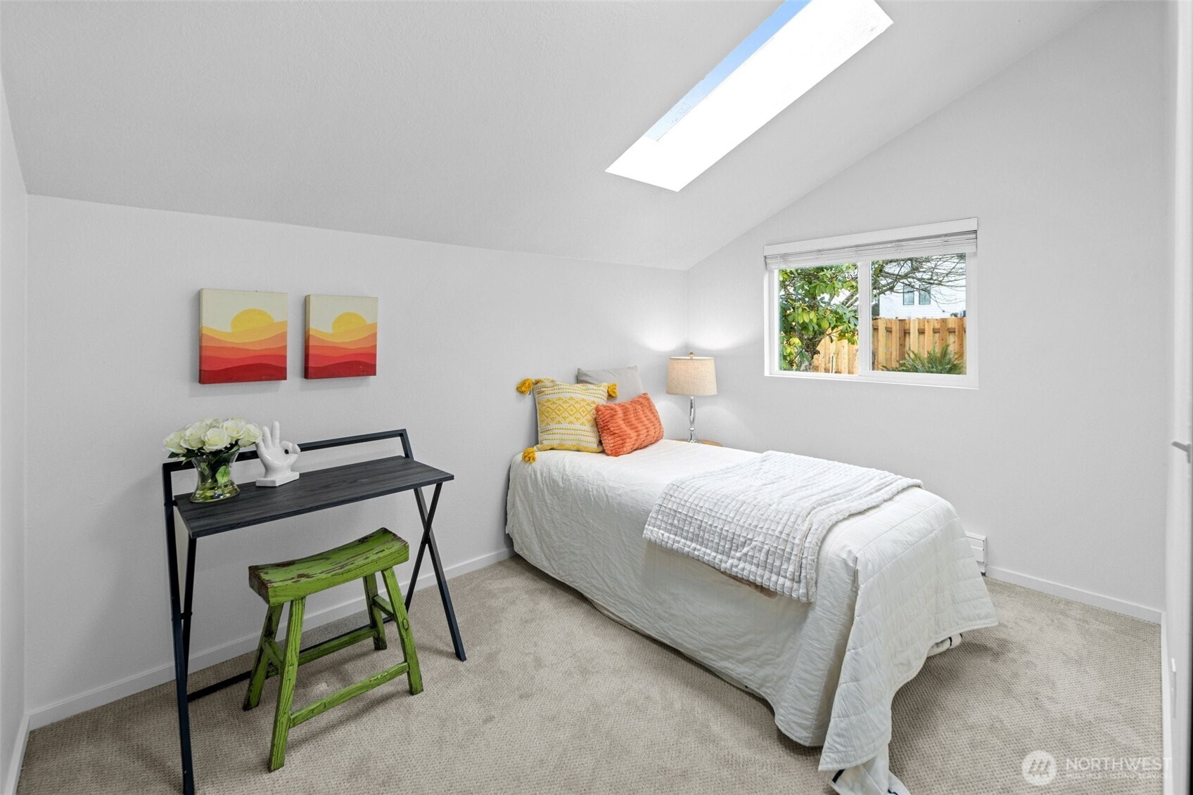 Walk-in pantry off kitchen with stackable washer and dryer.