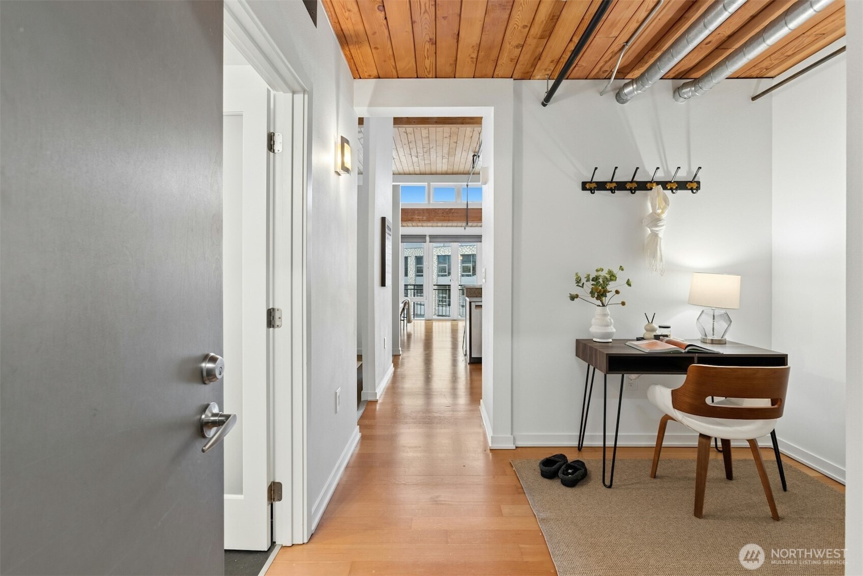 Looking from the foyer, to the right is a nice space for a desk mas shown or setup for