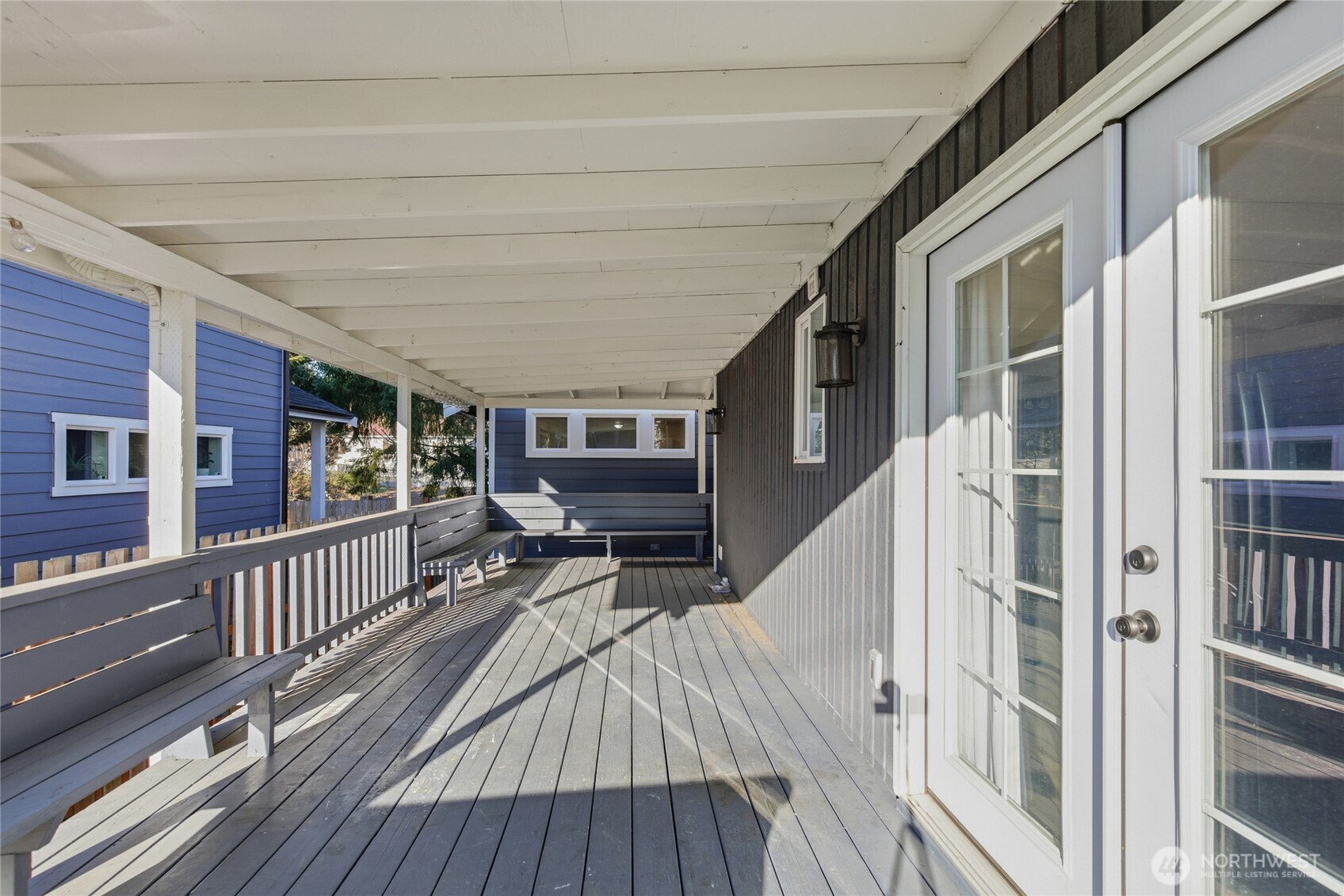 Main House: Outdoor Patio with French Doors that enter the Kitchen.