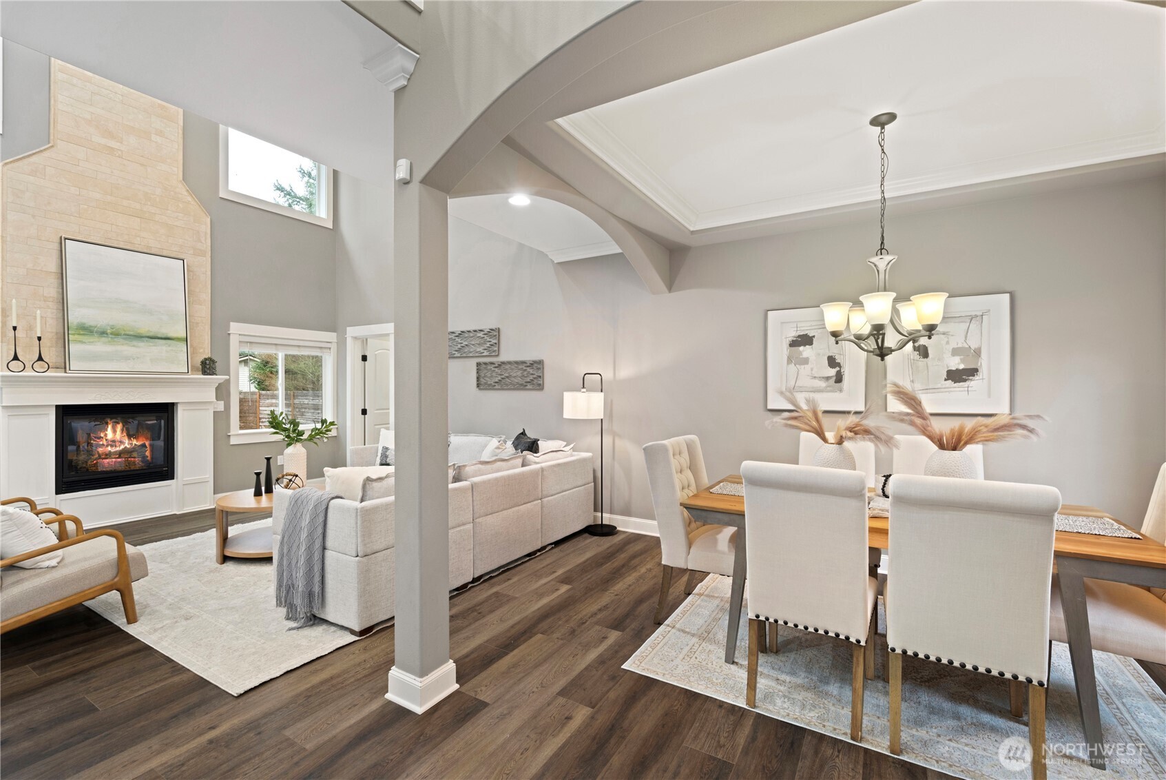 Impressive 2-story great room is filled with gorgeous natural light.  French doors lead to the private fully fenced back yard.