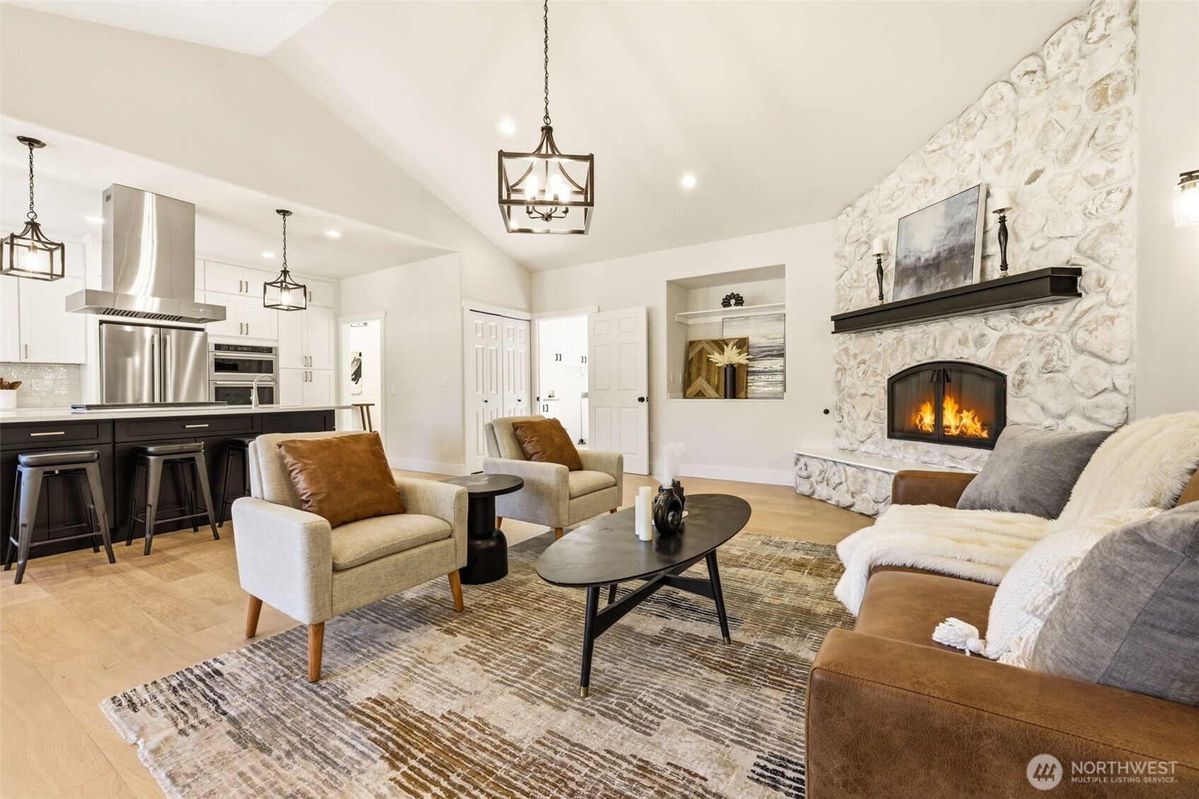 Open concept living room with soaring celiings.