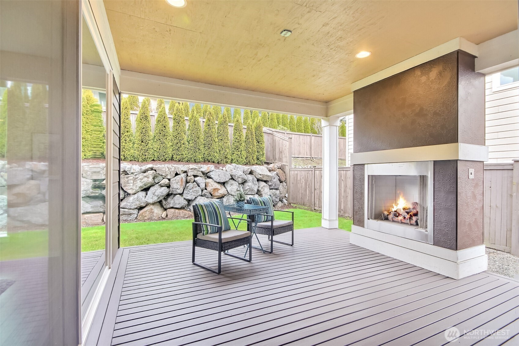 Large covered deck has cozy gas fireplace and plumbed for gas BBQ's