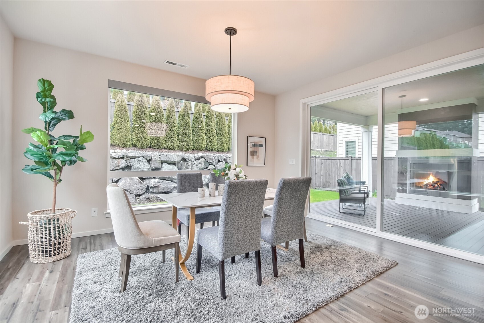 Dining room has Large windows to see the side and backyard. Wall size slider to covered deck