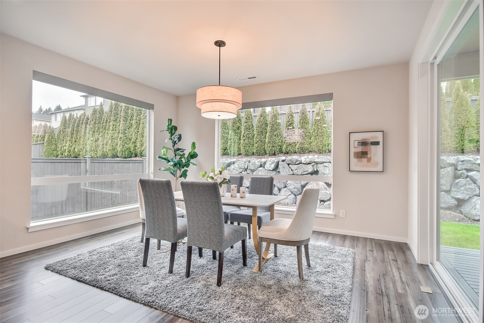 Dining room has a wall sliding glass door to covered deck