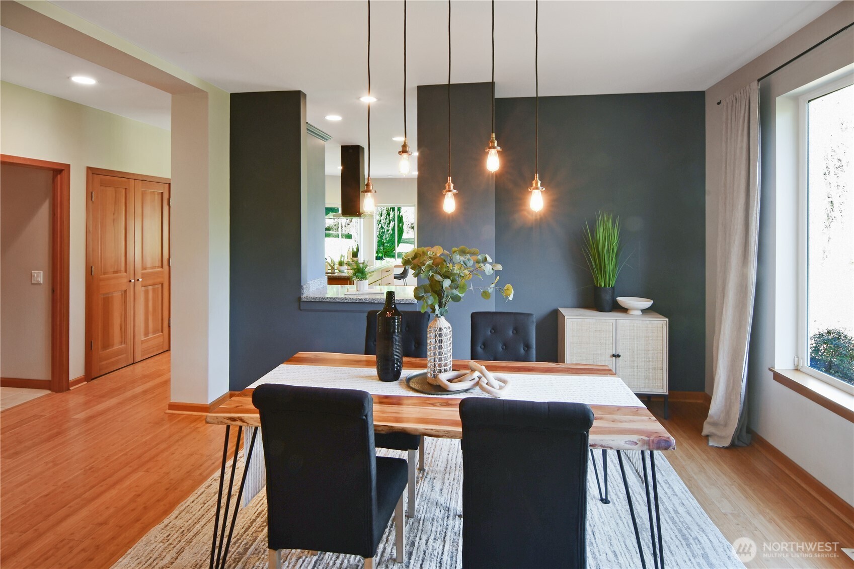 Versatile main-level office or bedroom with natural light and comfortable, single-level accessibility.