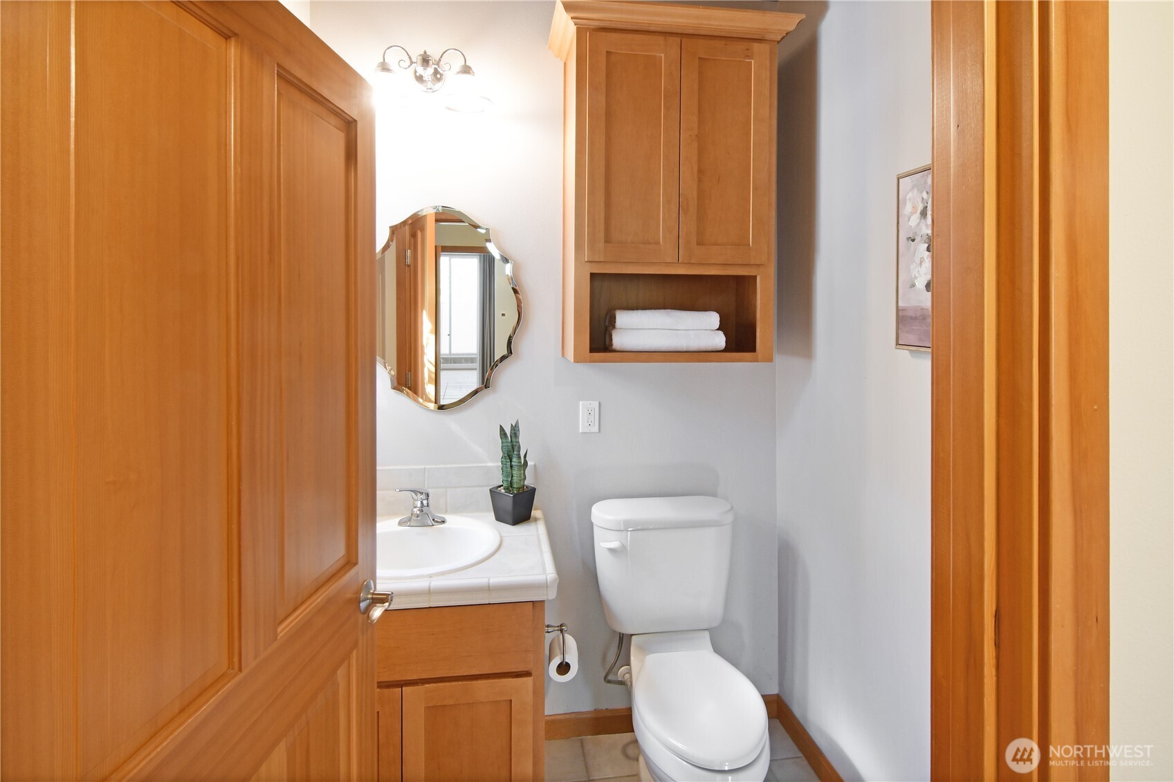 Inviting living room with large windows, cozy fireplace, and open layout ideal for gathering.