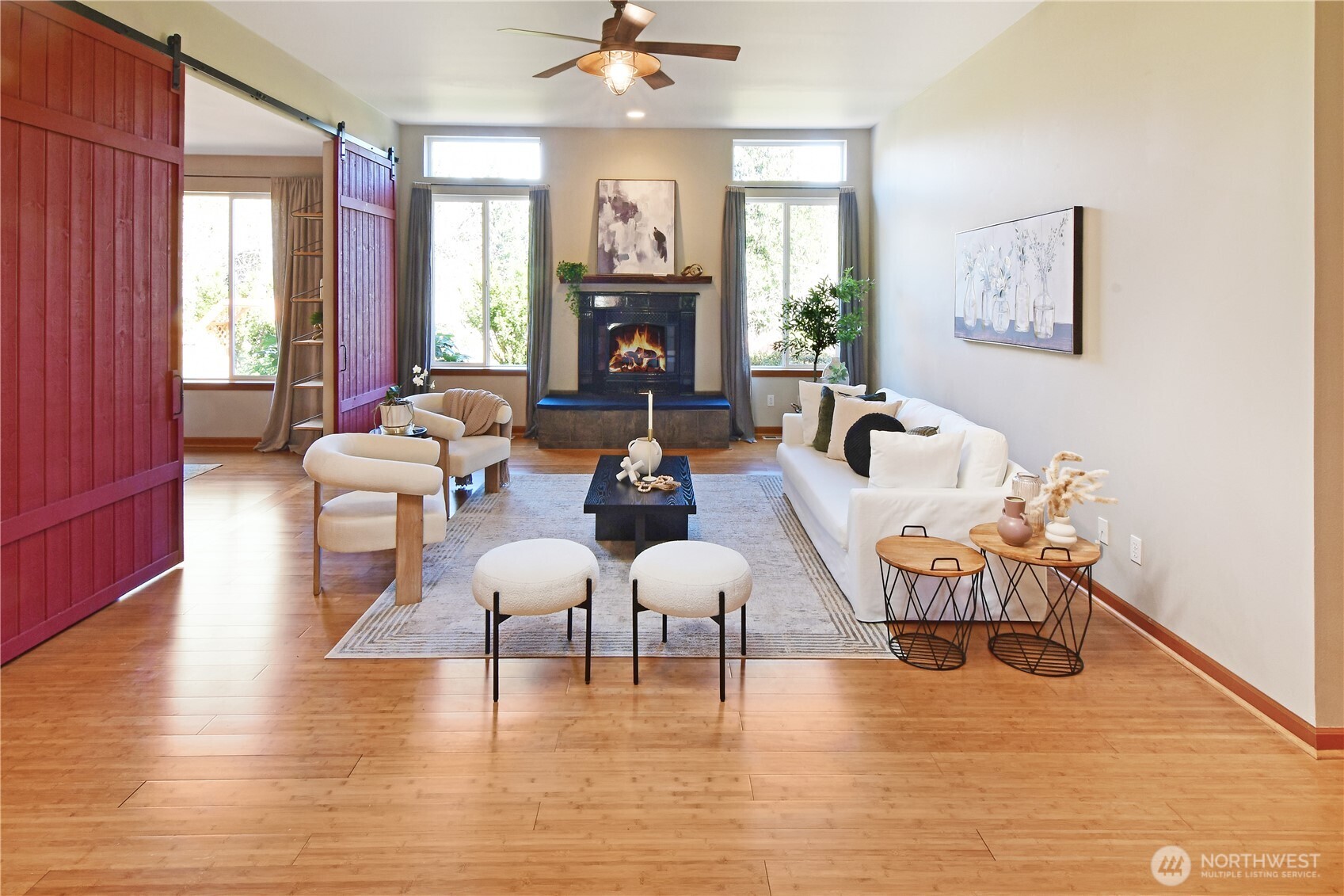 Private primary retreat with sitting area, large windows, and easy single-level comfort. Quality solid fir doors and trim and ceiling fan are great features. The light and bright walk-in-closet is amazing.