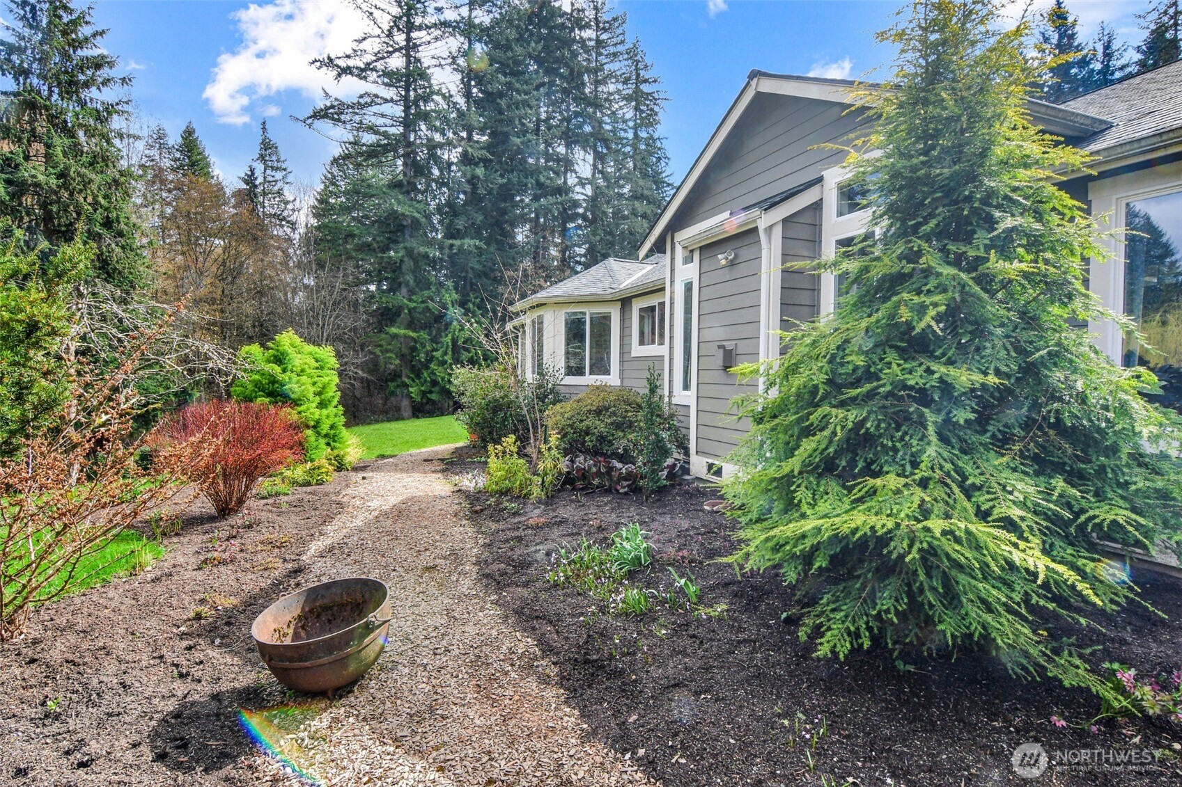 A garden shed for tools and mower.