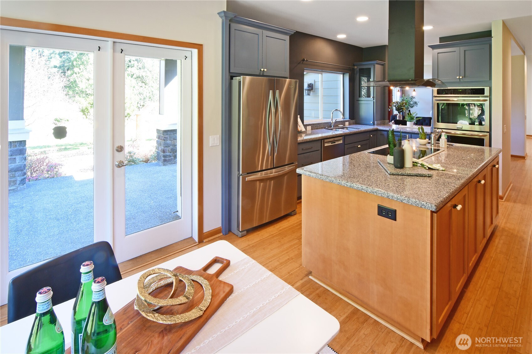 Open-concept kitchen featuring expansive counters, modern finishes, and excellent accessibility throughout. The prep sink in the island is a great feature and cooks love the easy clean glass top range with modern extractor fan.