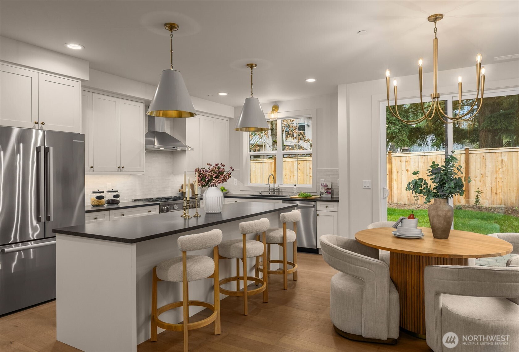 Living room open to kitchen and dining areas.