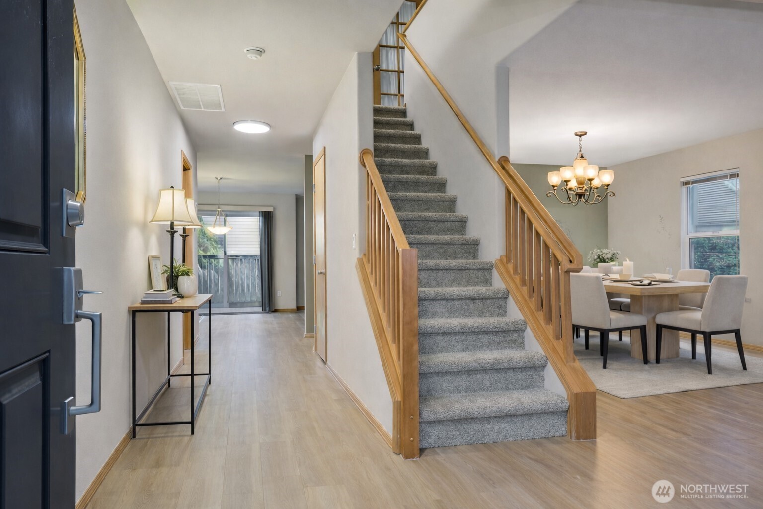 Virtually Staged. Enter to formal living room and dining rooms.