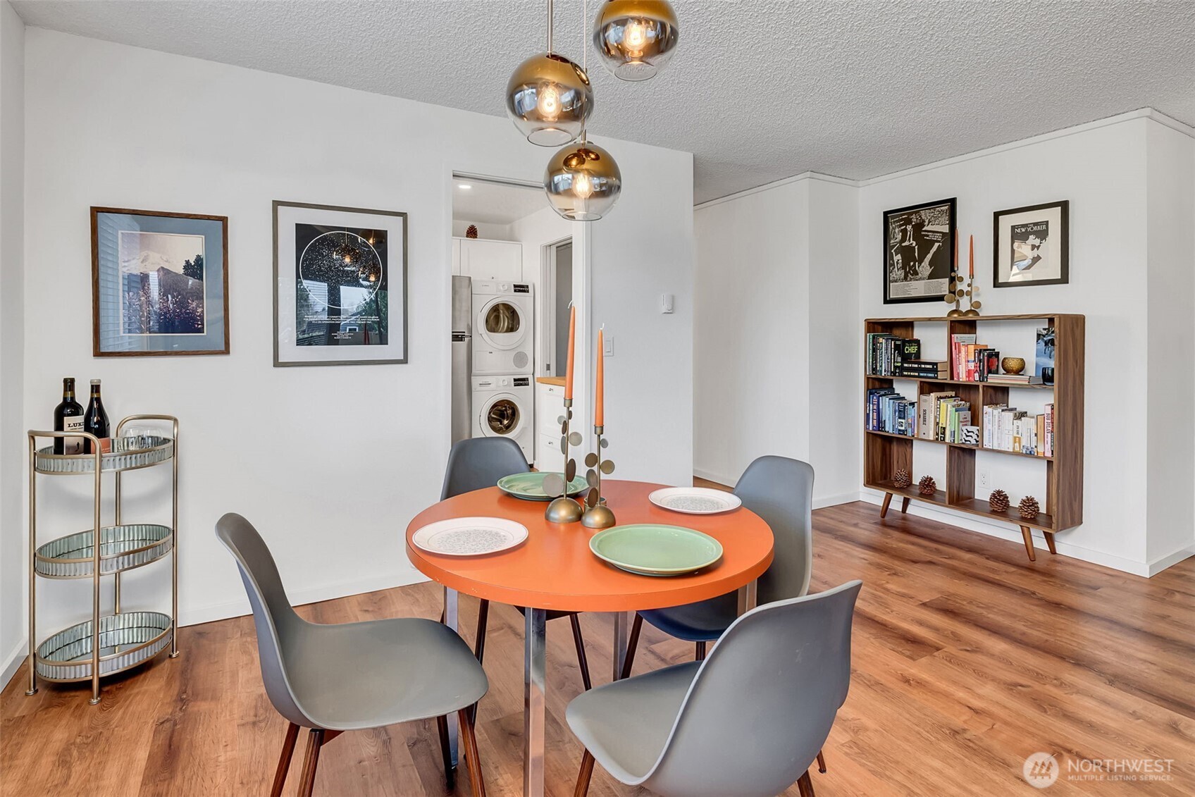 Updated kitchen show cases plenty of counter, prep space- new cabinets and in-unit laundry.